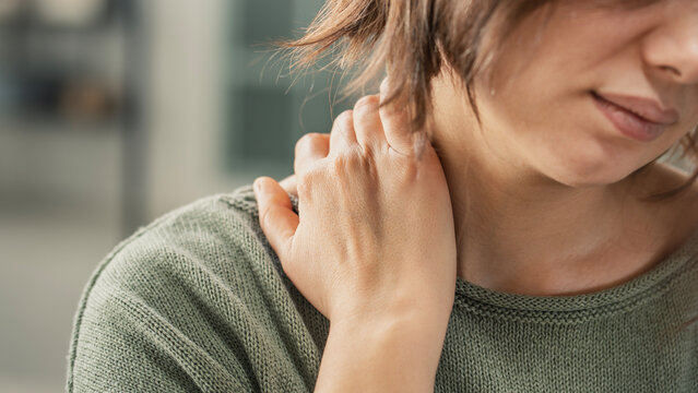 Young woman suffering from nape pain
