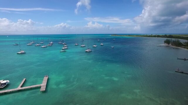 Anegada is an isolated coral reef island in the British Virgin Islands that is surrounded by reefs and picture perfect beaches. Catamarans and other boats anchor and moor in Setting Point Bay.