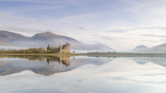 Kilchurn Castle Loch Awe Scotland. Historic castle ruin with reflections and dramatic Highlands landscape creates iconic travel destination.