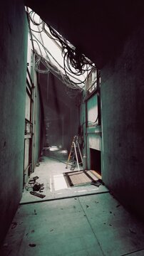 A narrow corridor displays a mix of industrial elements and decay. Sunlight pours through an opening, illuminating scattered debris and a ladder leaning against the wall.