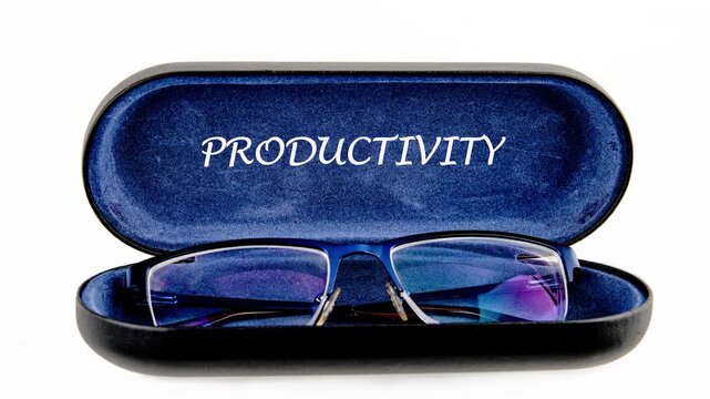 Glimpse the moment blue rimmed reading glasses settle into a soft blue velvet case, where the word PRODUCTIVITY emerges with clarity