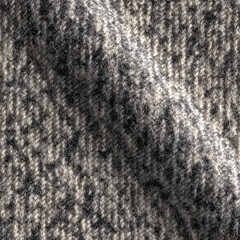 Fototapeta premium Close-up view of textured knitted fabric showing a mix of gray and white threads in soft daylight