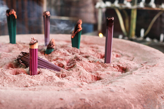 Burning Incense Sticks with Smoke at Buddhist Temple in Osu, Japan
