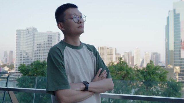 Young Asian man looking away thoughtfully with sad expression in city setting, emotional reflection and deep thinking, mental health and life 고민 concept, urban lifestyle and introspection