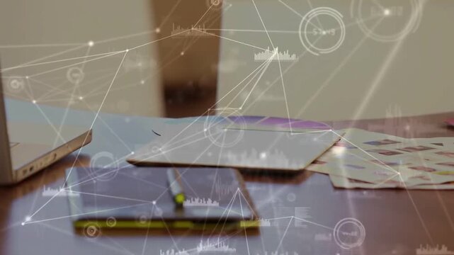 Camera panning, closed notebook holding green pen, translucent HUD drifting to highlight desk items