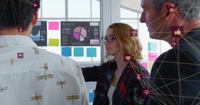 Tech lead pointing at glass, explaining data, moving icons linking notes to pie chart for planning