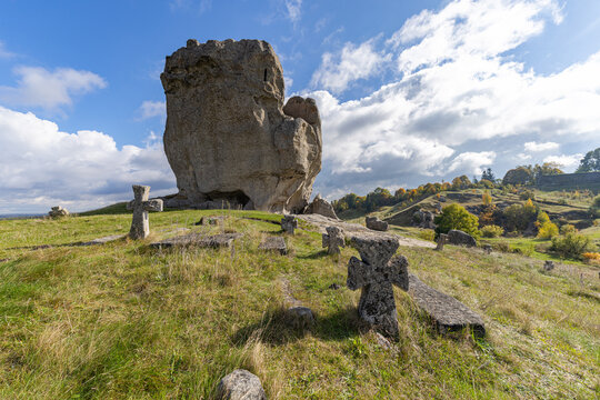 Ancient Devil&rsquo;s Rock and stone crosses in Pidkamin village