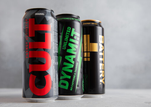 LONDON,UK - JULY 24,2025: Aluminium cans of Battery plus and Cult and Dynamit energy drinks on light table background.