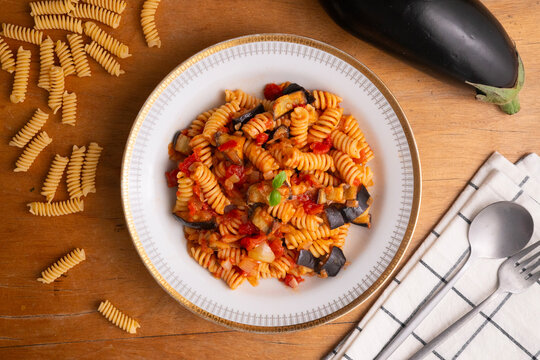 Delicious pasta alla norma with eggplant and tomatoes. Traditional italian recipe.