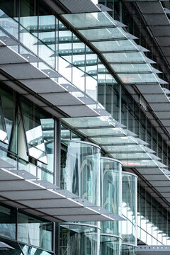 Abstract pattern of beams under modern glass canopy reveals industrial office structure and architecture creating geometric design background detail