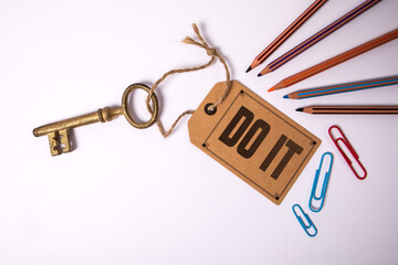 Do It Text on Tag Attached to Key Representing Action and Motivation Concept