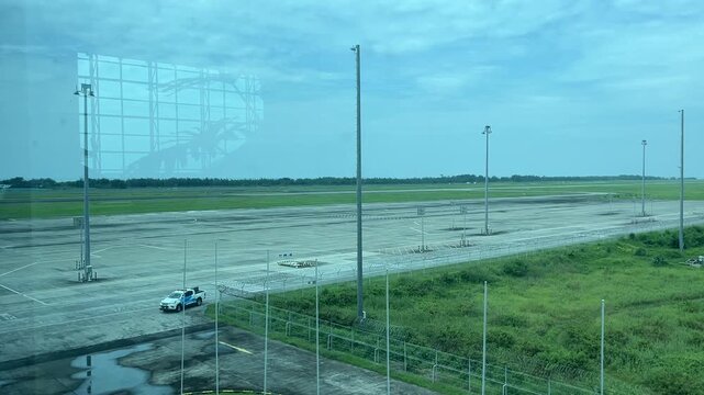 Security vehicle driving along an airport perimeter fence on January 20, 2026 in Yogyakarta, Indonesia