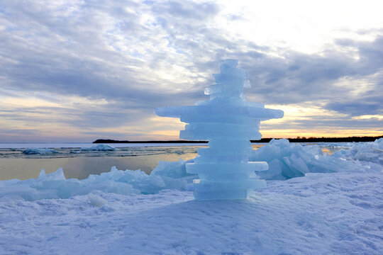 Ice sculpture on frozen Baltic Sea shore at sunset in R�gen