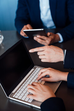 Business team working together with laptop and tablet in office