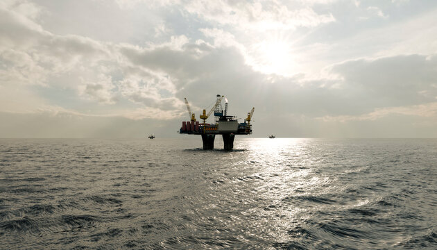 Offshore oil rig platform in sunlight on open sea