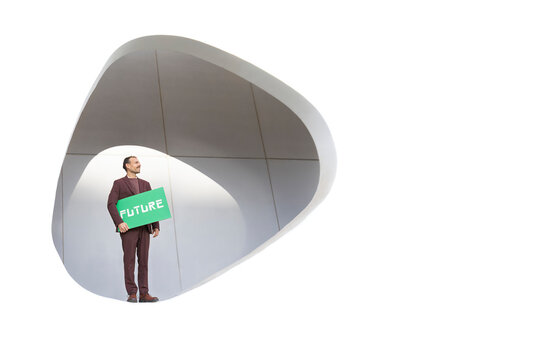 Businessman with future sign in front of modern white architecture