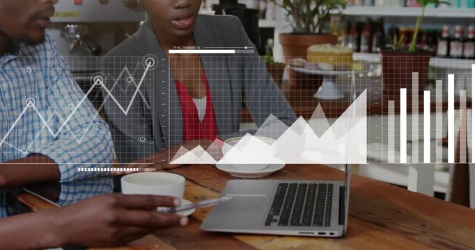Two partners tapping phone and typing laptop analyzing business data with moving charts over laptop