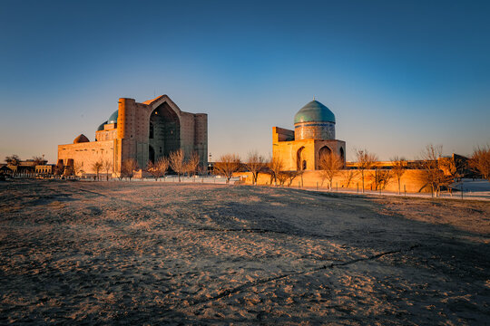 Stunning view of the unfinished mausoleum of Khoja Ahmed Yasawi in Turkistan, Kazakhstan, with the mausoleum of Rabia Sultan Begum in the foreground