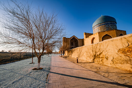 Stunning view of the unfinished mausoleum of Khoja Ahmed Yasawi in Turkistan, Kazakhstan, with the mausoleum of Rabia Sultan Begum in the foreground