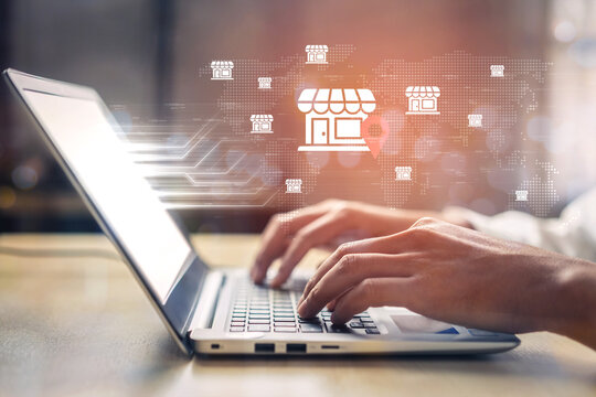 A professional typist works on a laptop in a contemporary office, illustrating digital marketing, e-commerce, and global business connections with visual elements. Gantry