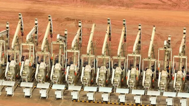 Drone footage showcasing an organized oil field with pumpjacks, emphasizing industrial productivity, energy demand, and the environmental considerations shaping today&rsquo;s energy sector.
