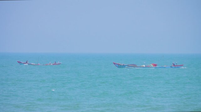 Vietnamese marine motor junks race across the South China Sea. Fearless fishermen