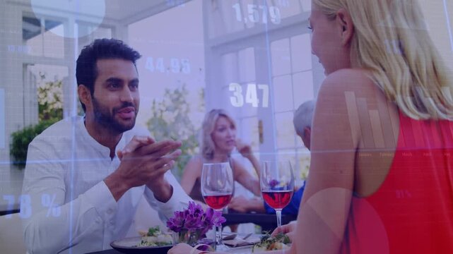 Two diners starting talking, launching business charts over faces, leaning and building rapport