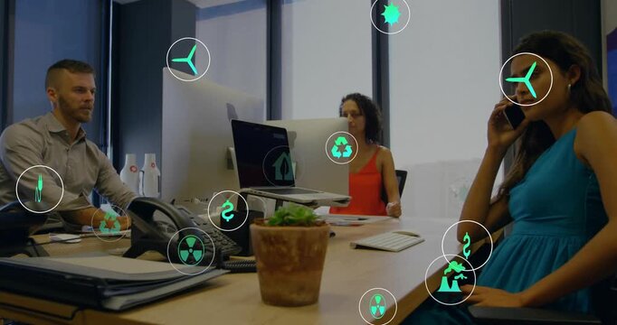 Right-side woman on phone while team watching monitor, green icons appearing, showing green metrics