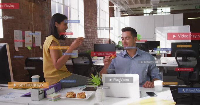 Woman offering pastry, man at laptop taking bite while floating UI labels overlaying business break