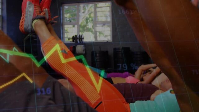 Fitness class on instructor cue doing V-up crunches to build core with line graphs tracking reps