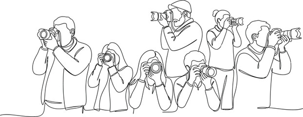 Naklejka premium group of photographers taking pictures