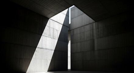 Obraz premium Angular light stream piercing through a stark brutalist concrete room, highlighting its abstract geometric design and modern minimalist aesthetic