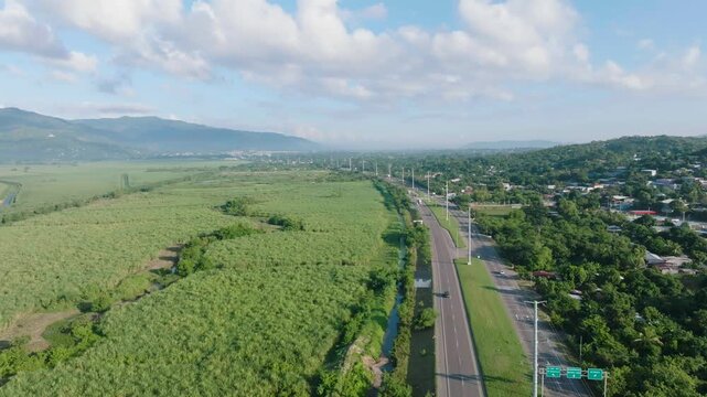 Aerial view of highway through farmland in Cort&eacute;s Honduras rural landscape