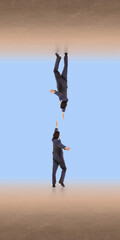 Businessman falling downward while reaching toward another hand in abstract space. Concept of risk...