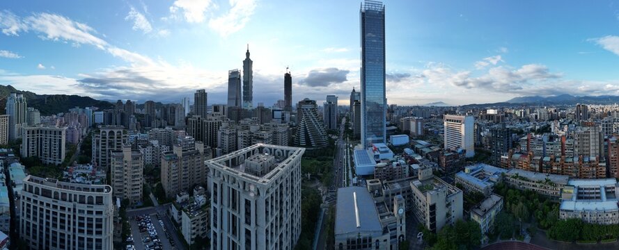 Panoramic aerial view of Taipei 101 and modern city skyline.