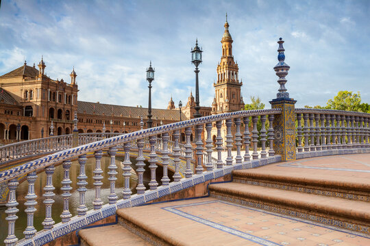 Bridge with ceramic tiled balustrades and wrought iron street lamps at Plaza de Espa&ntilde;a, Seville, Spain