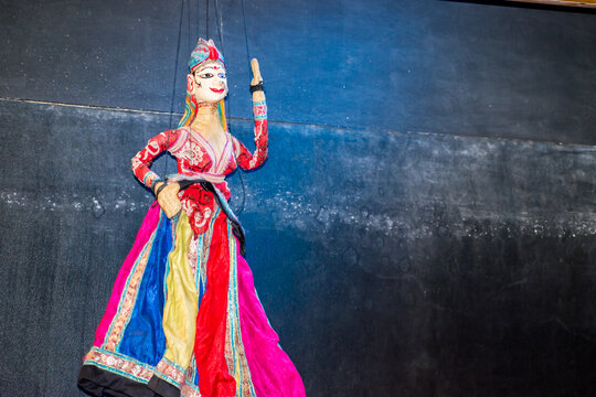 Kathputli or puppet of a dancing lady performing on a stage, showcasing the rich cultural heritage of Rajasthan, India