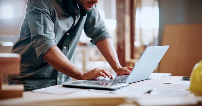 Hands, carpenter and typing on laptop in workshop for woodwork order, design review and inventory. Carpentry staff, man and tech with flare for client email, project invoice and furniture production