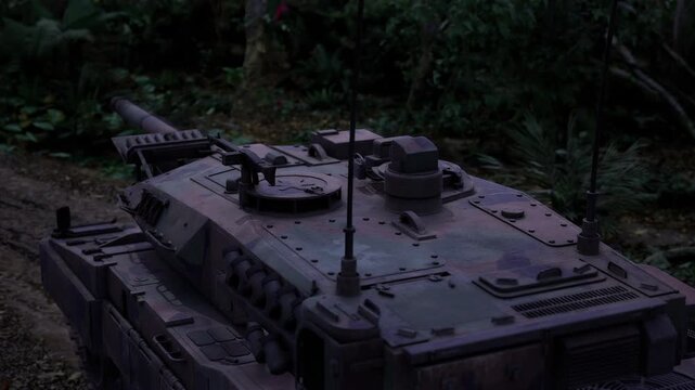 Armored vehicle poised on muddy trail at edge of forest, engine idle and hatches closed, radio mast upright, path winding into canopy suggests imminent maneuver