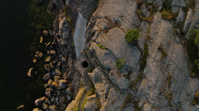 Birds eye aerial of a giant's kettle geological feature in Hankoniemi archipelago