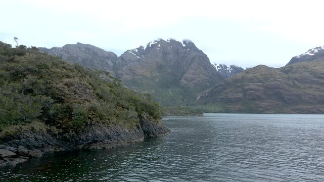 Calbuco chile patagonia river lake nature mountain trees clouds winter dusk morning drone