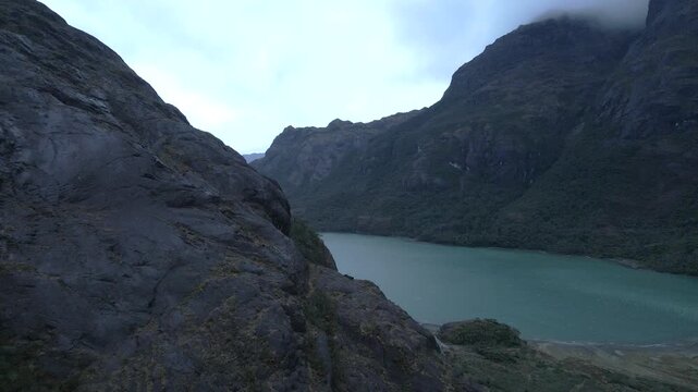 Calbuco chile patagonia river lake nature mountain trees clouds winter dusk morning drone