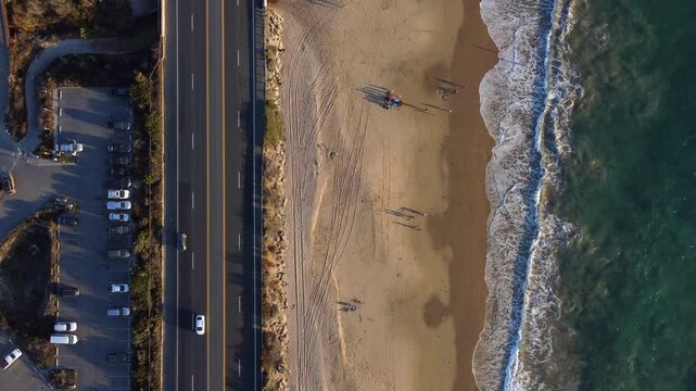 Looking Down on Pristine Beach Shoreline in a Tropical Paradise. Crystal Cove State Park in Orange County California, USA. Coastal landscape sandy beach at Pacific Ocean. Pacific Coast Highway