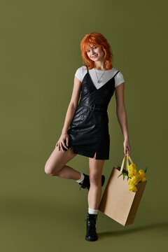 Spring fashion adventure with a stylish redhead in a leather dress and white tee