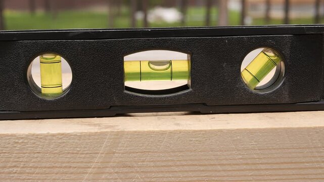 Construction level measuring wood alignment and precision work level tool for carpentry and building accuracy Level used by builder carpenter engineer repair worker for precise surface alignment