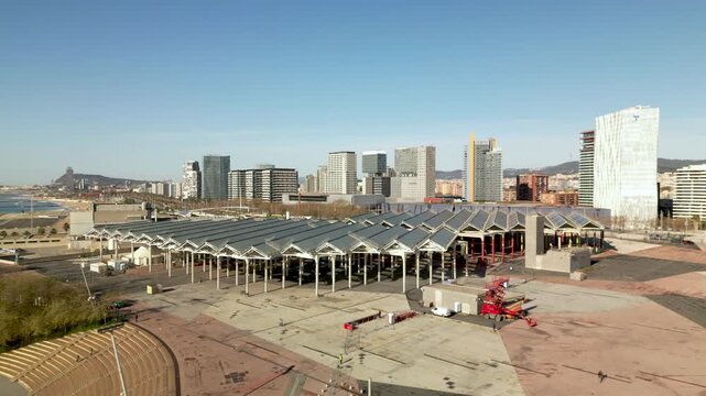parc del forum and poble nou aerial view with solar photovoltaic panels and mediterranean sea on a sunny day, modern urban architecture