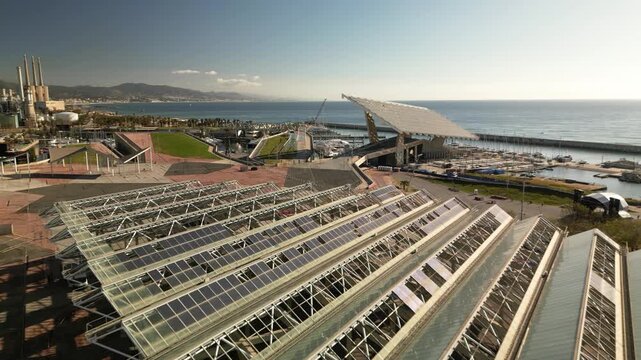 parc del forum aerial view with solar photovoltaic panels and mediterranean sea on a sunny day, modern urban architecture