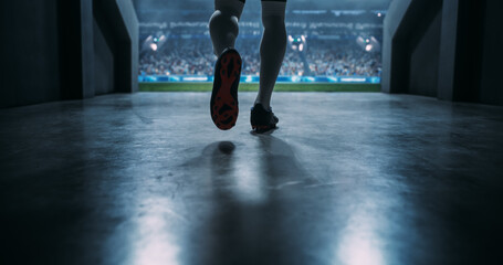 Low-angle View of a Male Soccer Player Striding Through the Stadium Tunnel Toward the Pitch Before an International Football Cinematic Style and Scale of Professionalism of a World Event.