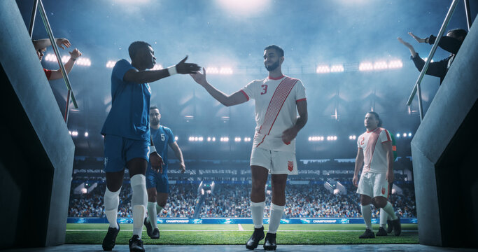 Black Male Soccer Player and White Male Opponent Exchange a Handshake after International Football Championship Victory. World International Cup League Match. Pro Players Playing it Cool After Game