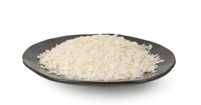 Raw flattened rice isolated. Dry rice flakes or poha, Indian breakfast food